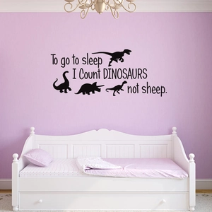 Black dinosaur wall decal featuring the phrase Count DINOSAURS not sheep for kids room