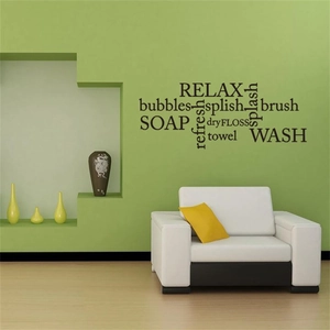 Modern black PVC wall decal with Relax and Soap lettering in a stylish bathroom setting