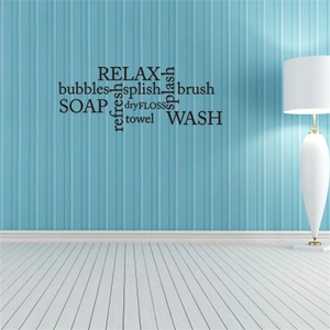 Close-up of Relax Soap Wash black vinyl wall decals on blue striped bathroom wall surface