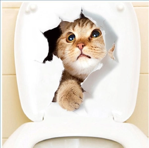 Creative 3D yellow tabby cat wall sticker appearing through a hole on toilet lid