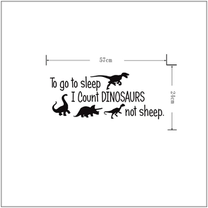 Detailed size chart for black dinosaur wall sticker measuring 57cm wide by 24cm high