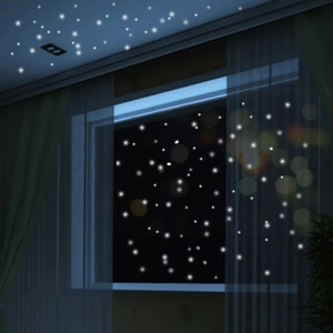 Glow in the dark dot stickers creating a starry night effect on bedroom ceilings