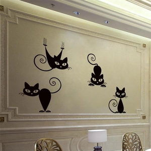 Set of four minimalist black cat wall stickers featuring different playful silhouettes