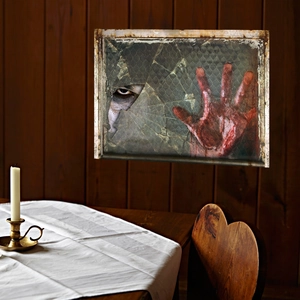 Halloween window sticker with bloody handprint and spooky eye on broken glass decor