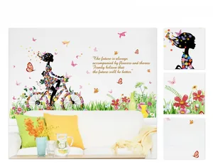 Pastel flower fairy wall decal with a girl riding a bicycle for living room wall art