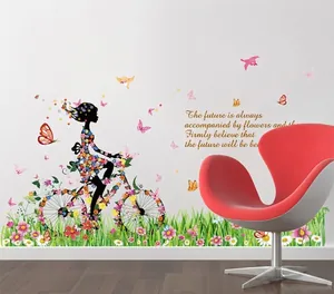 Floral fairy wall sticker showing a girl riding a bicycle with flowers and butterflies