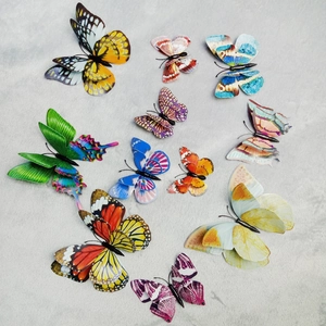 Detailed macro view of vibrant double-layer 3D butterfly wall stickers with realistic patterns