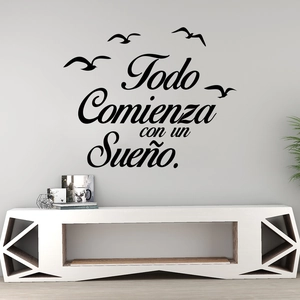 Adesivo murale spagnolo Todo Comienza con un Sueño in vinile nero con sagome di gabbiani