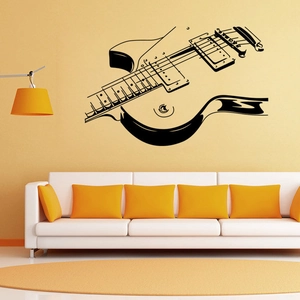 Artistic black guitar wall decal shown in a modern living room setting for home decor