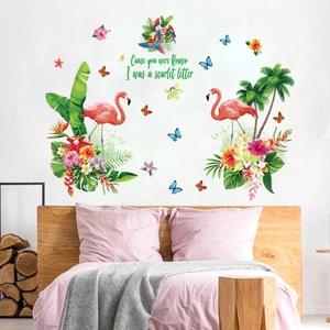 Tropical wall decals featuring pink flamingos, palm leaves and flowers for bedroom decor