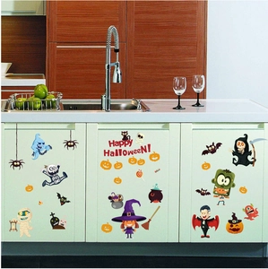 Cartoon Halloween PVC wall stickers with pumpkin and ghost motifs on white kitchen cabinets