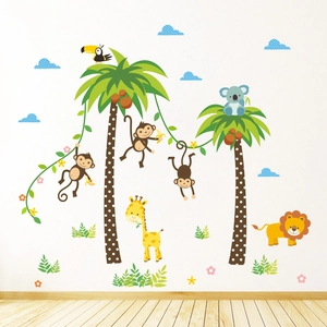 Detail of tropical jungle wall stickers set with monkeys, lion, and palm tree for nursery