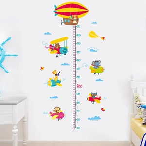 Cartoon animal height chart wall sticker featuring giraffe and elephant in airplanes