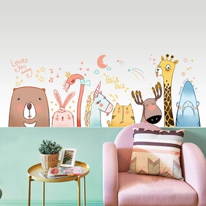 Detailed view of cute cartoon animal wall stickers featuring a bear and bunny on a green wall