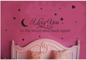Black vinyl wall decal featuring To The Moon quote with stars and moon for nursery decor