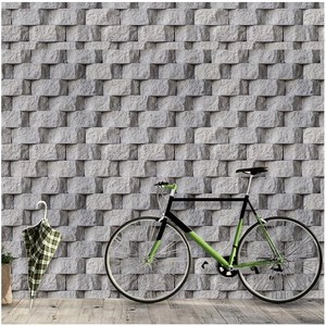 Detailed view of 3D industrial grey brick wall mural in a minimalist living room setting