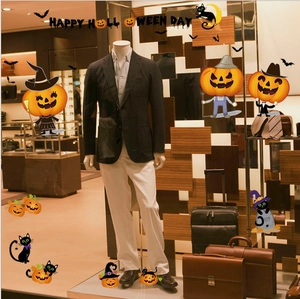 Slim fit black blazer and white trousers set displayed on a retail mannequin store