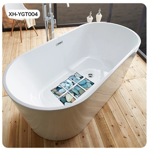 Detail view of anti-slip bathtub mat with realistic blue-grey 3D pebble pattern
