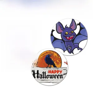 Detail of round Halloween stickers featuring a castle, purple bat, and black crow on white
