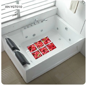 Close-up of waterproof non-slip bathtub stickers with red strawberry pattern designs
