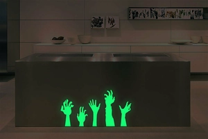 Luminous Halloween zombie hand wall stickers glowing in green for festive home decoration