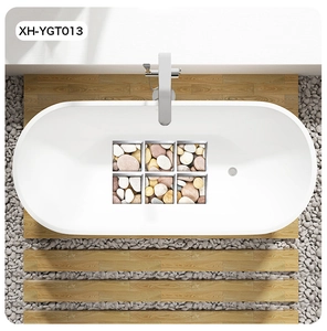 Bird's eye view of pebble patterned self-adhesive anti-slip stickers inside a white bathtub