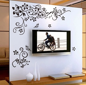 Adesivi murali con rampicanti neri e farfalle per decorazione parete TV del soggiorno