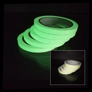 Luminous self-adhesive tape rolls glowing in dark and beige original color view