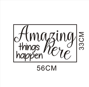 Detail of 'Amazing things happen here' vinyl wall decal with creative typography