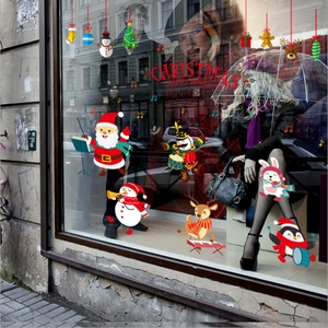 Christmas window stickers featuring cartoon Santa and animals playing musical instruments