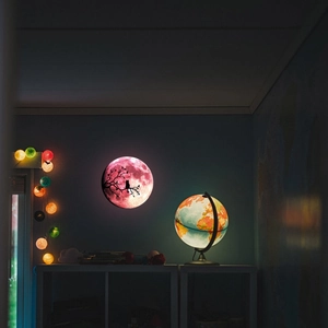 Luminous moon wall sticker with pink texture and black cat silhouette in warm night light