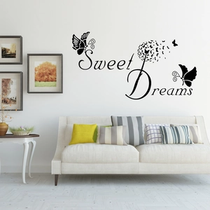 Detail of Sweet Dreams wall sticker with dandelion and butterfly on white living room wall