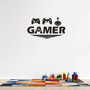 Detail view of black gamer wall decals featuring game controllers and gamer text in kids room