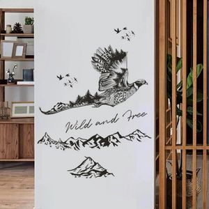 Ink style eagle wall sticker with forest silhouette and Wild and Free quote on white wall