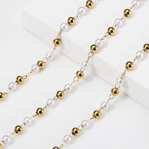 Elegant gold and white beaded chain featuring faux pearls and metallic mirror beads