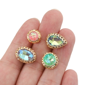 Assorted teardrop and oval crystal beads in vintage gold filigree settings for DIY jewelry