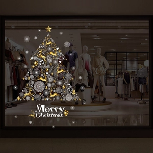 Golden and white Christmas tree window decal with snowflakes and Merry Christmas text