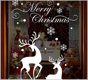 White Christmas window decals with Merry Christmas text snowflakes and reindeer silhouettes