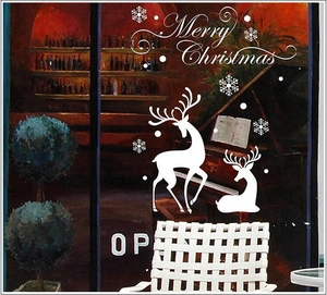 White Christmas window decals with snowflakes, reindeer silhouettes and Merry Christmas text