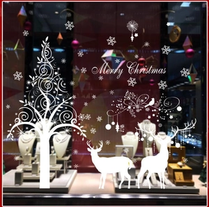 White Christmas reindeer wall stickers with tree and snowflakes on store window