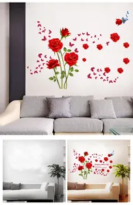 Dettaglio di adesivi murali con rose rosse e farfalle che mostra l'effetto prima e dopo