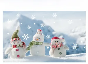 Three plush Christmas snowmen set with colorful hats and scarves in a snowy landscape