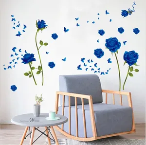 Detail of blue rose wall stickers with butterfly accents and romantic English quote