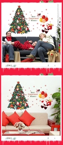Detail of Christmas tree wall stickers with Santa and reindeer in a cozy living room decor