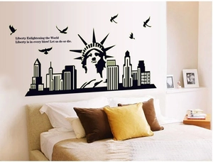 Luminous wall sticker featuring Statue of Liberty skyline and birds on a bedroom wall
