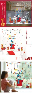 Detail view of festive Christmas wall stickers with snowman and star patterns on glass