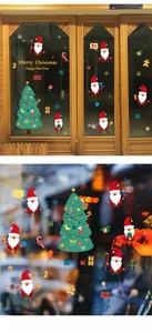 Detail of Christmas Santa and decorated tree window stickers for holiday home decoration