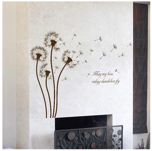 Deep brown dandelion wall stickers with quote above a fireplace on marble wall