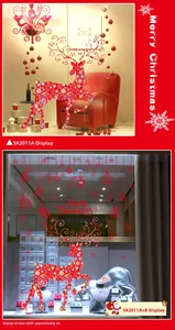Detail of red Christmas reindeer window decals and snowflakes for shop display