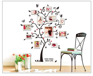 Dettaglio dell'adesivo murale albero genealogico nero con cuori e scritta amore per foto